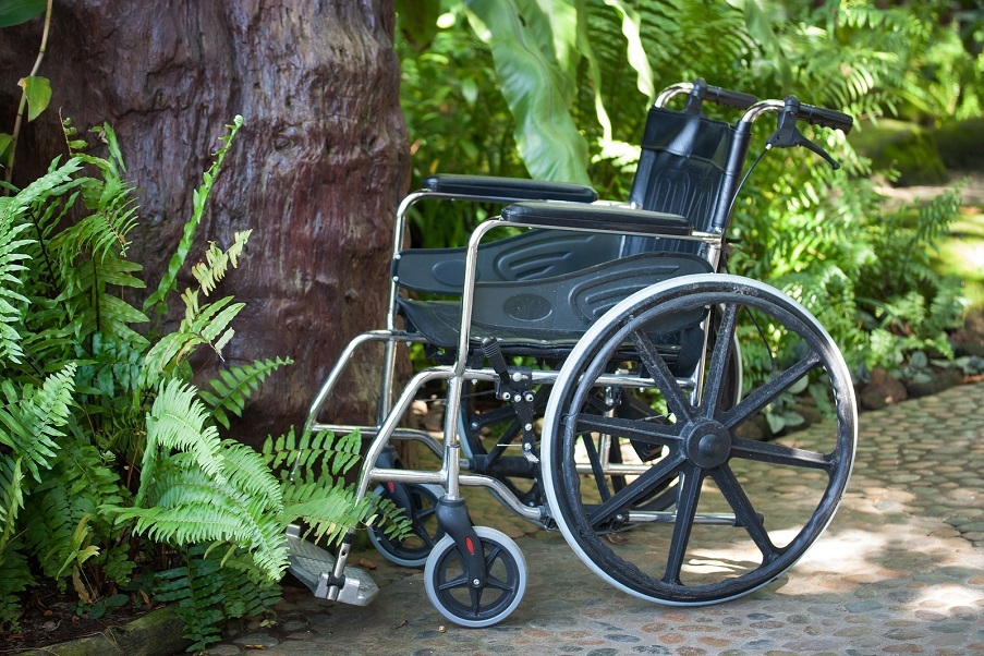 A wheelchair in a wheelchair accessible garden.