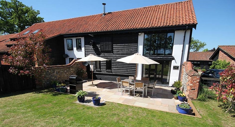 A patio outside of a barn conversion