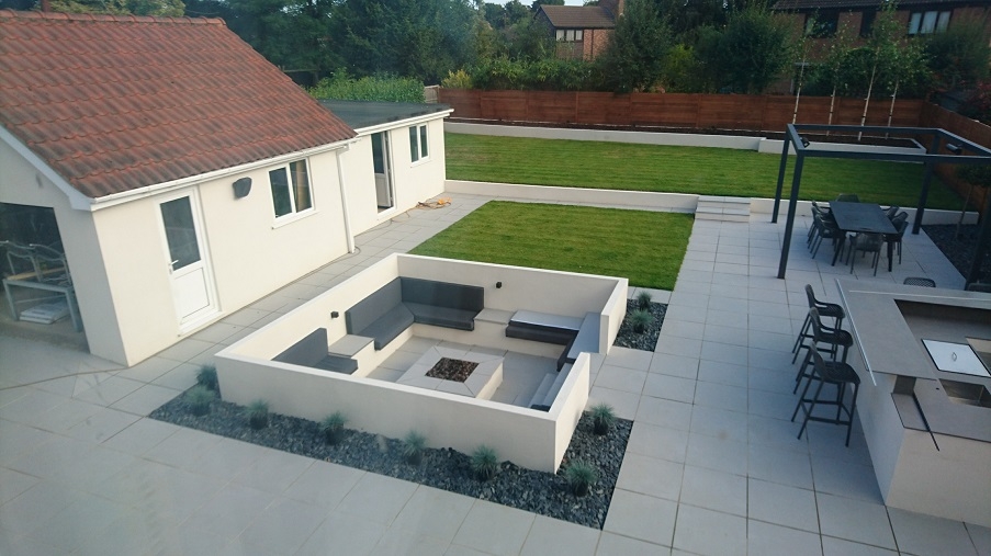 A built-in seating area we installed with a fire pit over the summer.