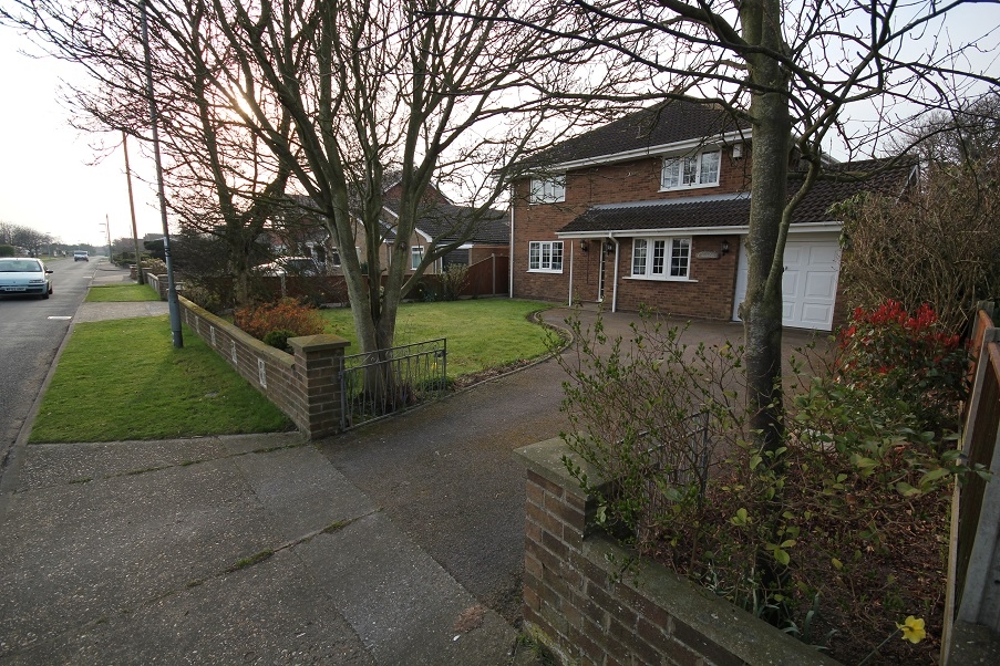 A house with an old concrete driveway