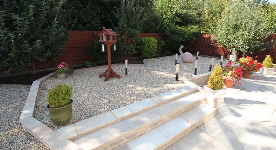 Plant pots arranged on a gravel garden