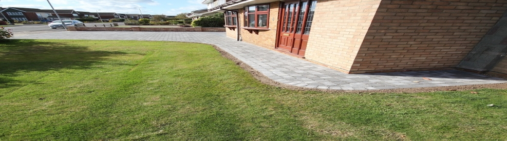 Charcoal block paving grass area